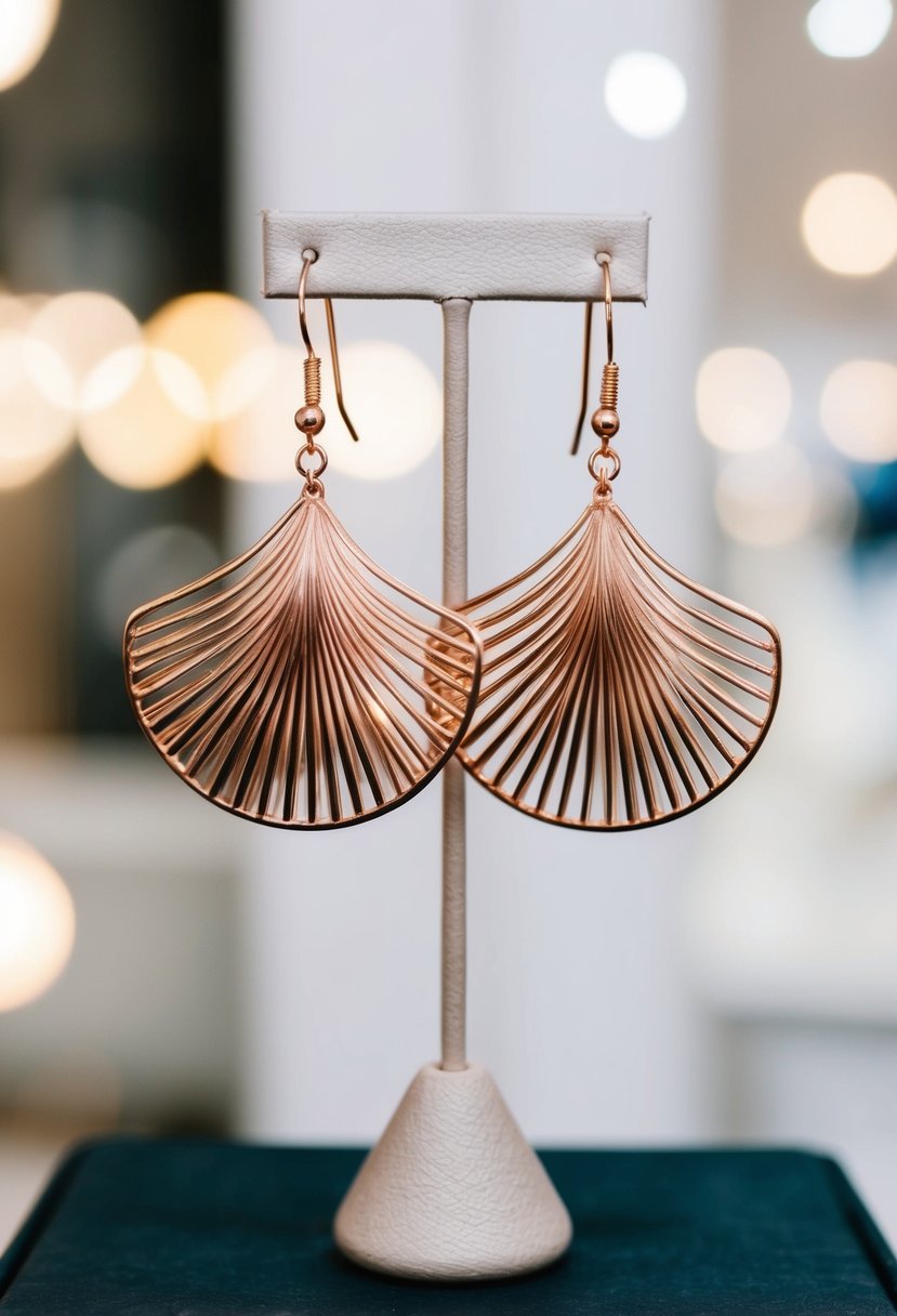 A pair of rose gold fan earrings, delicately hanging from a display stand, catching the light with their intricate design