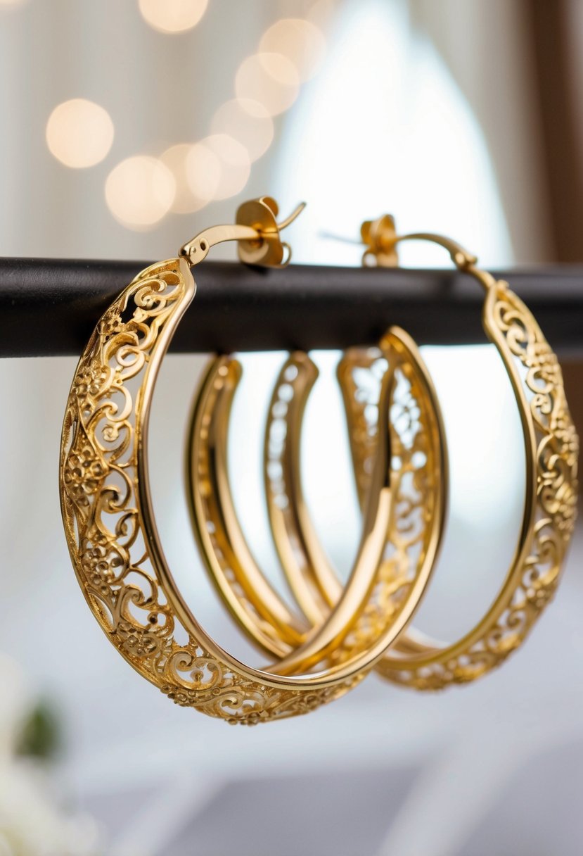 Two ornate gold hoop earrings intertwined with delicate filigree designs, gleaming in the soft light of a wedding setting