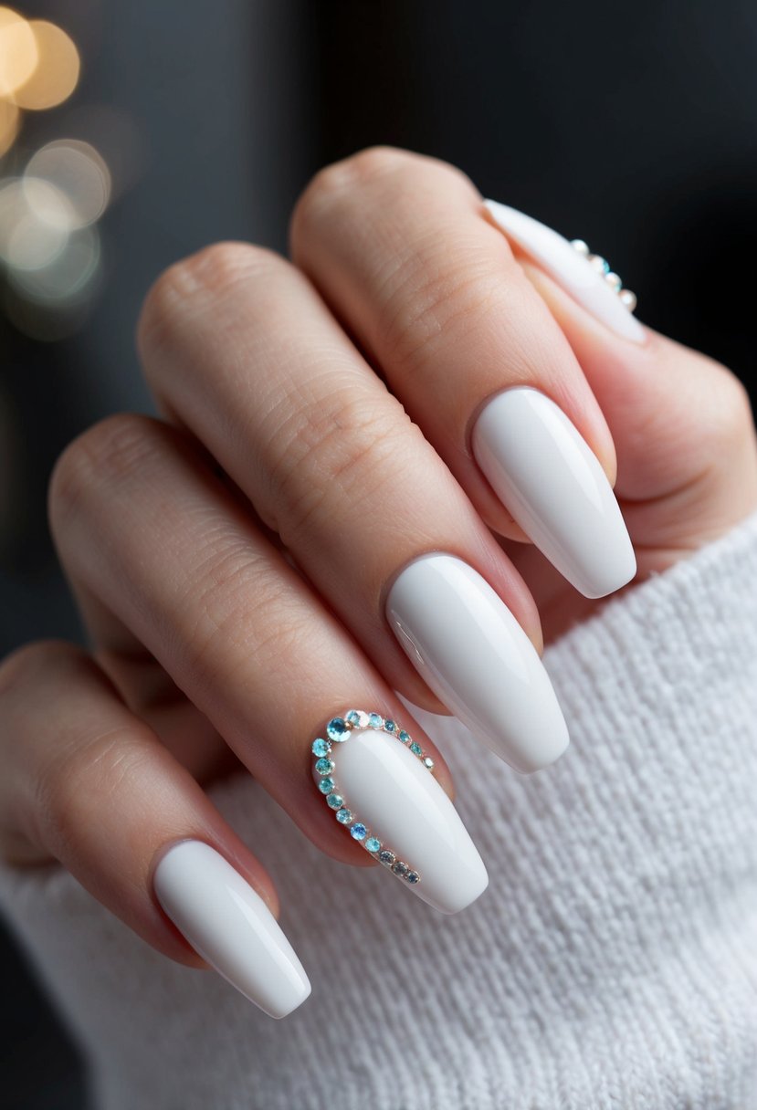 A close-up of white nail art with delicate rhinestones, conveying elegance and sophistication