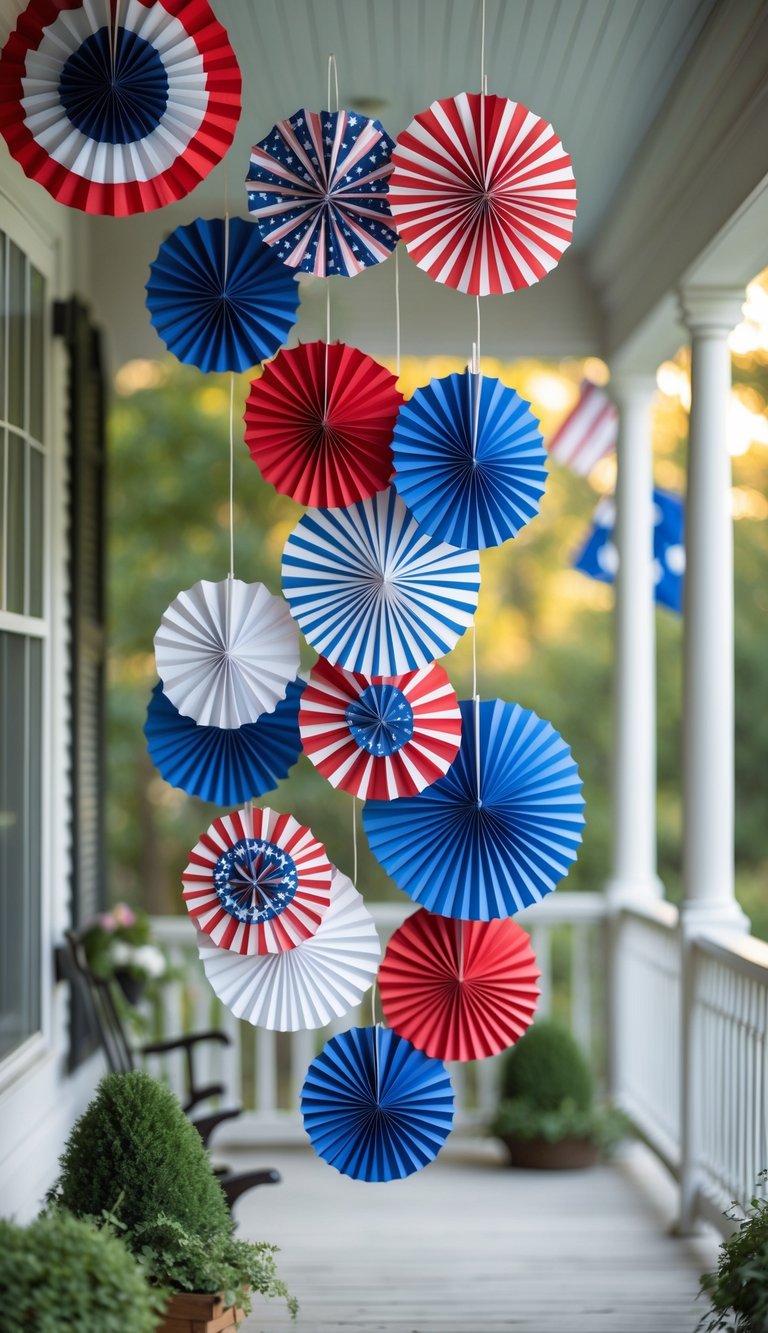 Hanging paper fans in red, white, and blue colors displayed on a porch.